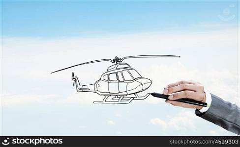 Designer draw helicopter. Hand drawing with stylus helicopter model on sky background