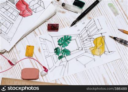 designer makes a sketch of the interior. background - drawing, markers, pencil, eraser, ruler, paints, calculator