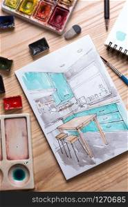 designer makes a sketch of the kitchen interier. background - sketch, watercolor paints, brushes, palette, glass with water