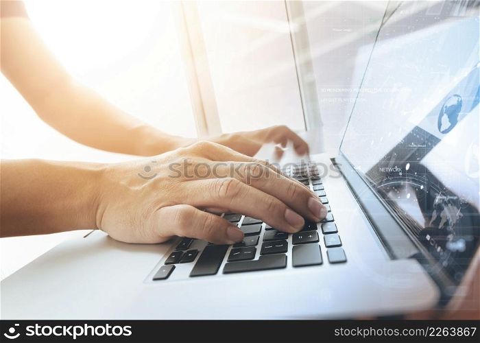 designer moving hands working with laptop computer and digital web design diagram as concept