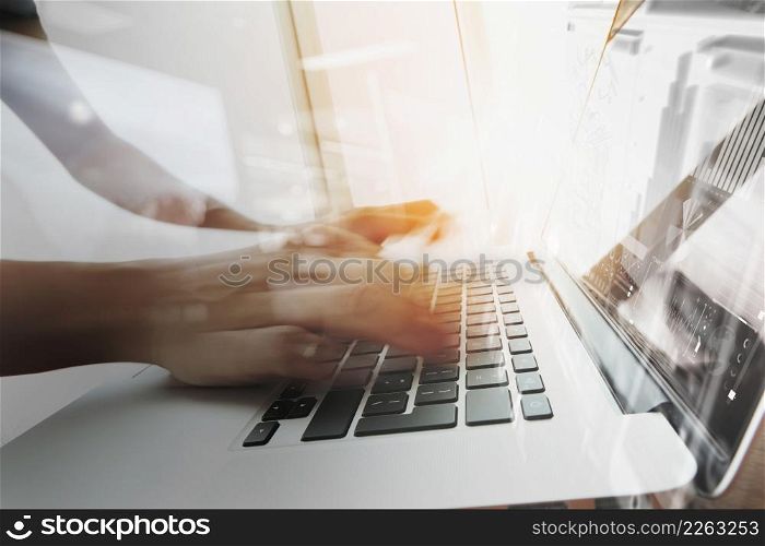 designer moving hands working with laptop computer and digital web disign diagram as concept