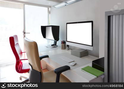 Designer office desk with computer screens in white