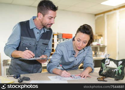 designer sketching pattern for marble plaque