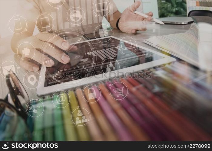 Designer using smart phone and digital tablet and laptop computer in modern office with virtual screen interface icons diagram as concept
