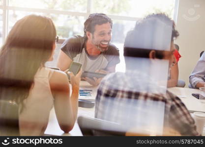 Designers Having Meeting Viewed Through Window