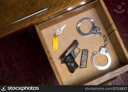 Desk Drawer of a Law Enforcement Officer Small Caliber Handgun
