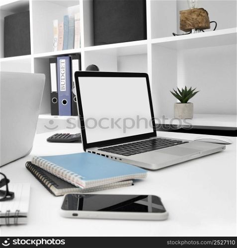 desk surface with laptop smartphone