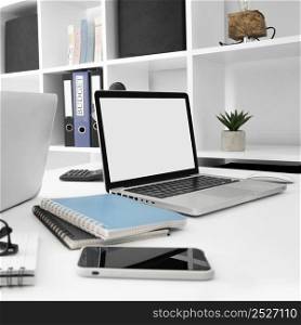 desk surface with laptop smartphone