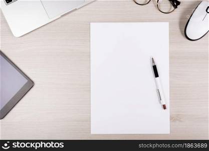 desk with glasses and a white sheet