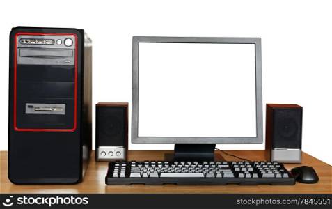 desktop computer, display with cut out screen, keyboard, mouse, speakers on wooden table isolated on white background