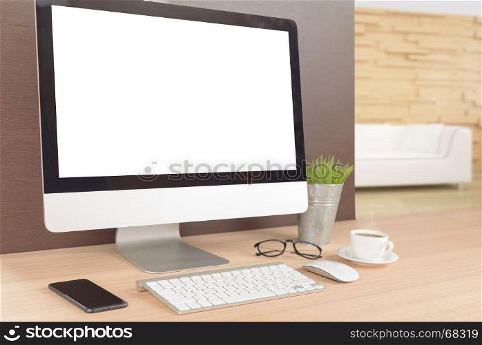 desktop computer on work table showing white screen perspective angle view