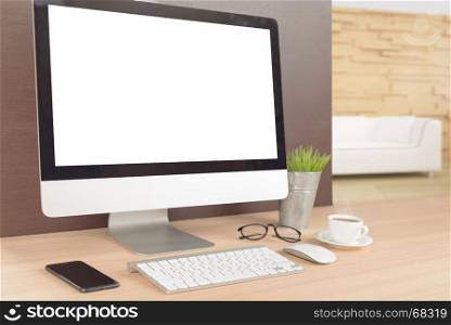 desktop computer on work table showing white screen perspective angle view