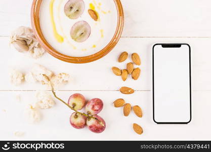 desktop with smartphone soup dish