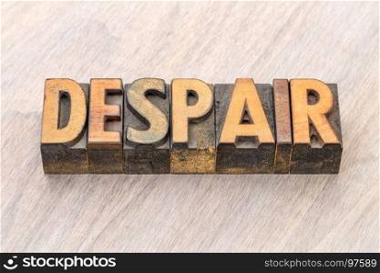 despair word abstract in vintage letterpress wood type blocks