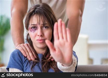 Desparate wife with aggressive husband in domestic violence conc. Desparate wife with aggressive husband in domestic violence concept. Desparate wife with aggressive husband in domestic violence conc