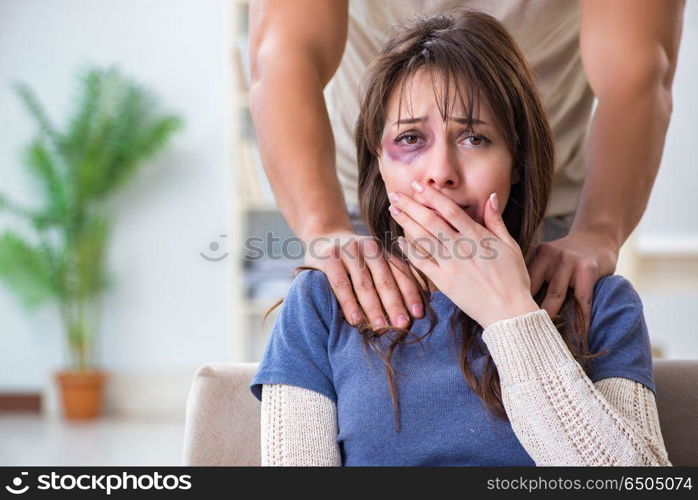 Desparate wife with aggressive husband in domestic violence conc. Desparate wife with aggressive husband in domestic violence concept. Desparate wife with aggressive husband in domestic violence conc