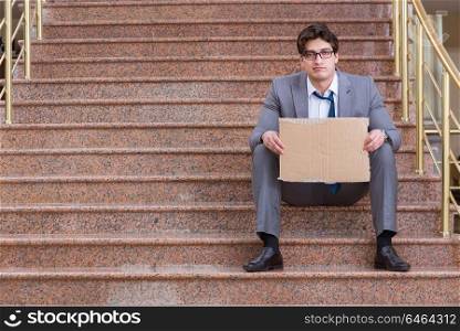 Desperate businessman begging on the street
