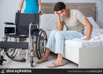 Desperate man on wheelchair with his sad wife