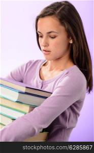 Desperate student girl carry stack of books purple background