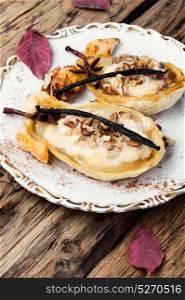 dessert baked pear. Autumn dish of pears stuffed with cheese, nuts and spices