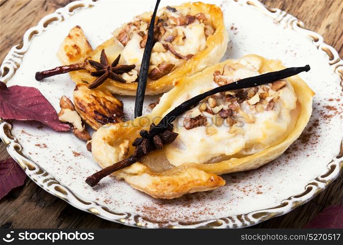 dessert baked pear. Autumn dish of pears stuffed with cheese, nuts and spices