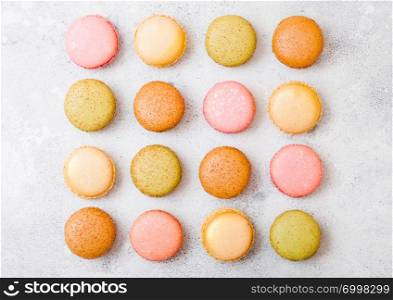 Dessert cake macaron or macaroon on stone kitchen table background. Top view. Space for text.