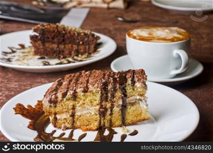 Dessert cakes with banana and coffee at table