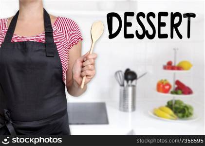 dessert cook holding wooden spoon background.. dessert cook holding wooden spoon background
