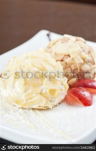 Dessert set of ice-cream with almond, chocolate and grapes