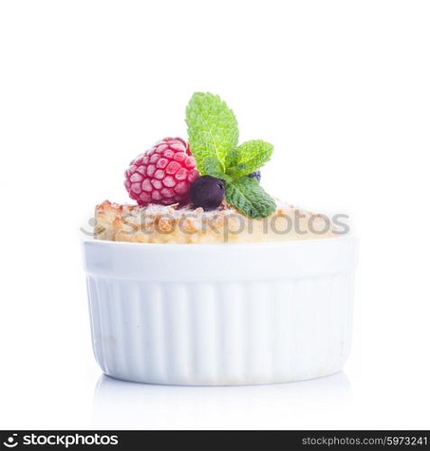 Dessert with berries and mint decor in white raclette isolated on white. Dessert with berries