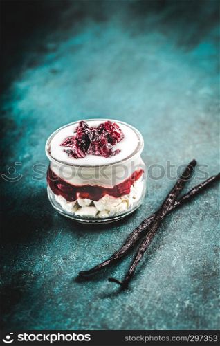 Dessert with meringue, cream and cranberry
