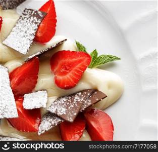 Dessert with strawberries, vanilla cream and chocolate.. Dessert with strawberries, vanilla cream and chocolate