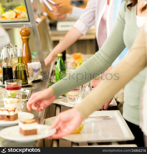 Desserts at cafeteria people with serving tray self service canteen
