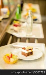 Desserts on serving tray cafeteria self service fruit salad cake