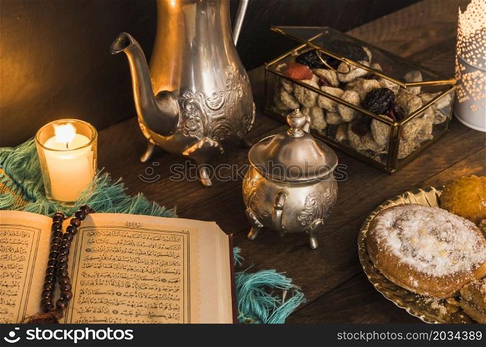 desserts tea set near religious book