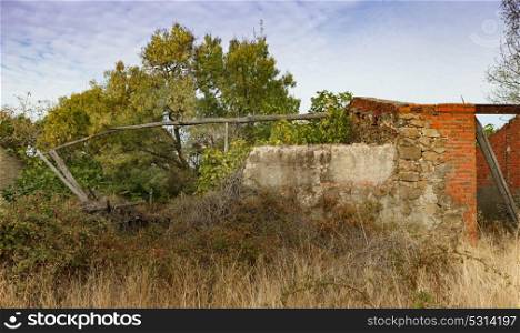 Destroyed house in the countryside and with wild vegetation