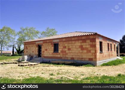 Detached house under construction in rural area. Detached house under construction