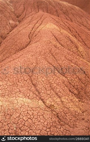 Detail close up of dry, cracked dirt mound in desert area