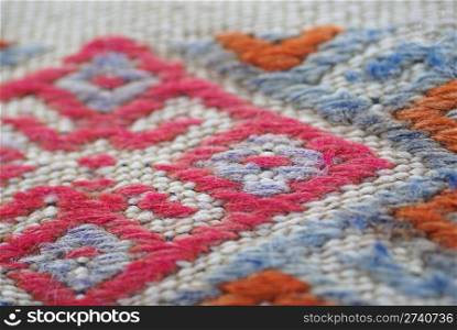 Detail,diamond pattern, tightly woven knots of vintage Turkish kilim