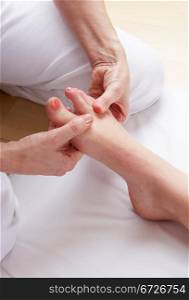 Detail foot reflexology massage