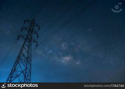 Detail from the Milky way on sky with  silhouette high voltage pole, long speed exposure at night.. silhouette high voltage pole
