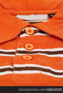 Detail image of orange shirt.