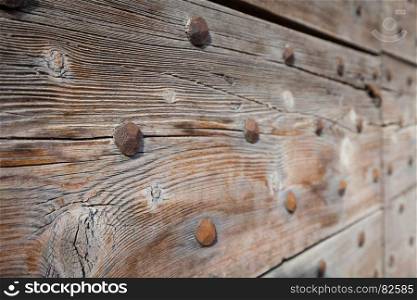 Detail of a 200 years old Italian door, made of wood. Background use.