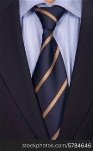 detail of a business man suit with blue tie
