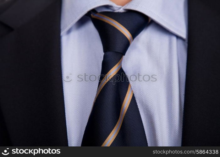 detail of a business man suit with blue tie