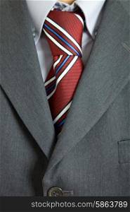 detail of a business man suit with colored tie