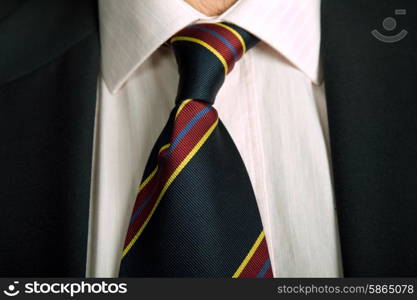 detail of a business man suit with colored tie