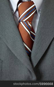 detail of a business man suit with colored tie