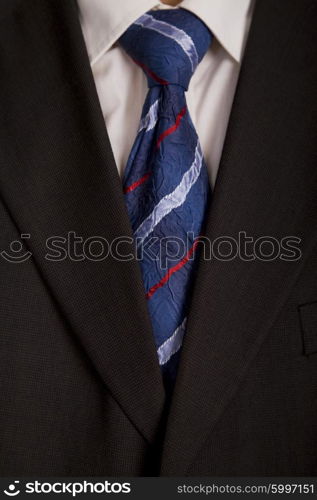 detail of a business man suit with colored tie