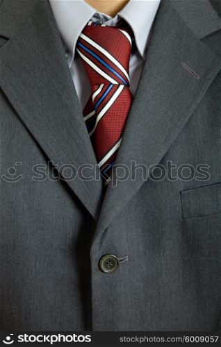 detail of a business man suit with colored tie